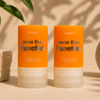 Lumaya Invisi Glow Sunstick products on a neutral background with natural light.